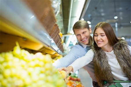 Smiling couple in a store Stock Photo - Budget Royalty-Free & Subscription, Code: 400-08732695