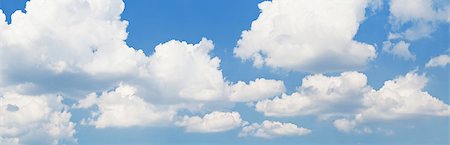 Background of Light blue sky with fluffy clouds. Horizontal panorama Stock Photo - Budget Royalty-Free & Subscription, Code: 400-08732998