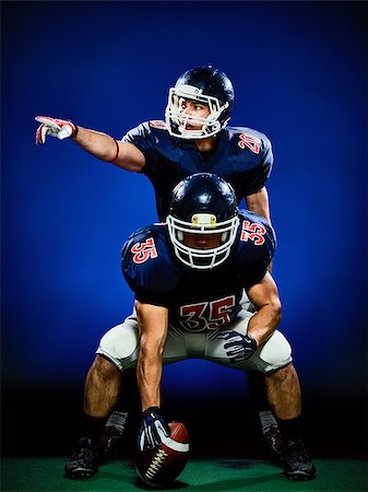 simsearch:400-08787080,k - two american football players men isolated on colorful black background Foto de stock - Super Valor sin royalties y Suscripción, Código: 400-08733443