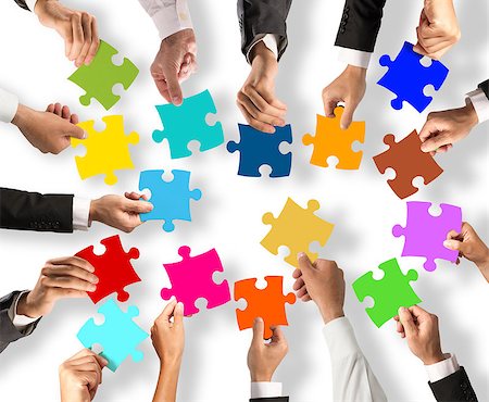 Business people join the colorful puzzle pieces. Concept of teamwork and integration Stock Photo - Budget Royalty-Free & Subscription, Code: 400-08749338