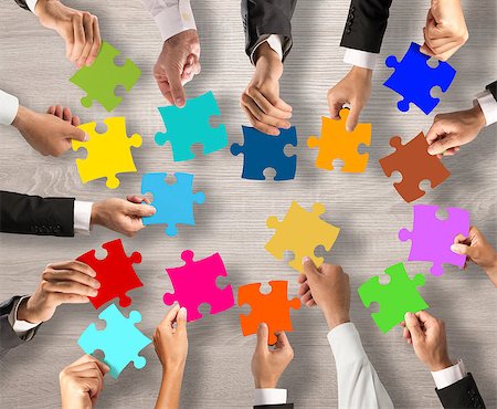 Business people join the colorful puzzle pieces Stock Photo - Budget Royalty-Free & Subscription, Code: 400-08749345