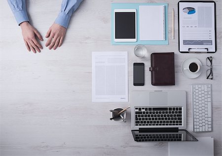 simsearch:400-09222181,k - Businessman working at office desk hands detail with copyspace and various objects on the right, top view Fotografie stock - Microstock e Abbonamento, Codice: 400-08749499