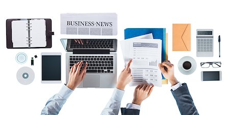 Business people working together at office desk and checking financial report, she is pointing at a number Stock Photo - Budget Royalty-Free & Subscription, Code: 400-08749621