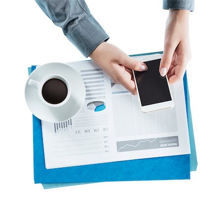 Business woman working at desk and using a touch screen smart phone, hands close up Stock Photo - Budget Royalty-Free & Subscription, Code: 400-08749642