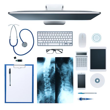 simsearch:400-08751444,k - Doctor's desktop with medical equipment, computer and X-ray of human bones on white background, top view Photographie de stock - Aubaine LD & Abonnement, Code: 400-08749654