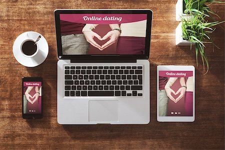 simsearch:400-08749588,k - Online dating website on a laptop display, hardwood desktop on background Stock Photo - Budget Royalty-Free & Subscription, Code: 400-08749712