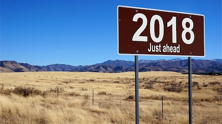 2018 Just Ahead  brown road sign with blue sky and wilderness Stock Photo - Budget Royalty-Free & Subscription, Code: 400-08754143