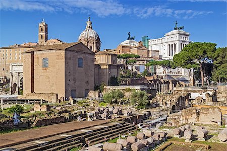 The Roman Forum is a rectangular forum (plaza) surrounded by the ruins of several important ancient government buildings at the center of the city of Rome. Curia and Santi Luca e Martina church Stock Photo - Budget Royalty-Free & Subscription, Code: 400-08754767