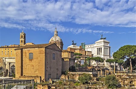 The Roman Forum is a rectangular forum (plaza) surrounded by the ruins of several important ancient government buildings at the center of the city of Rome. Curia and Santi Luca e Martina church Stock Photo - Budget Royalty-Free & Subscription, Code: 400-08754768