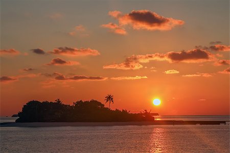 sunset in the ocean near Maldives Foto de stock - Royalty-Free Super Valor e Assinatura, Número: 400-08755975