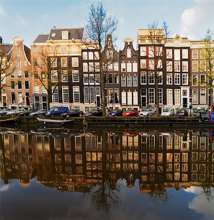 Facades of dutch houses over canal with mirror reflections, Amstardam, Netherlands Stock Photo - Budget Royalty-Free & Subscription, Code: 400-08755970