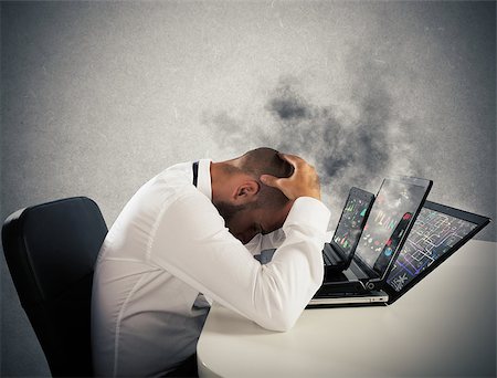 simsearch:400-09030070,k - Businessman with worried expression with computers in smoke Fotografie stock - Microstock e Abbonamento, Codice: 400-08750514
