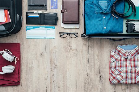 simsearch:400-09222181,k - Getting ready for a trip and packing a suitcase before leaving; accessories, clothing and personal items on a desktop, travel and vacations concept Fotografie stock - Microstock e Abbonamento, Codice: 400-08751435