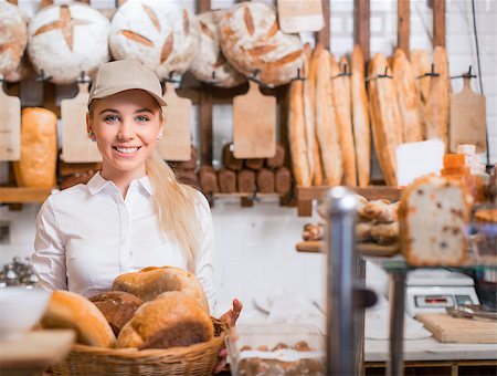 Young baker with basket at a counter Stock Photo - Budget Royalty-Free & Subscription, Code: 400-08751681