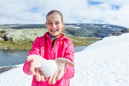 simsearch:862-03889629,k - Best Norway hike. Beautiful girl play snow in the summer mountains Stock Photo - Budget Royalty-Free & Subscription, Code: 400-08752437