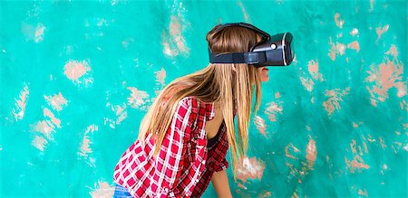 technology, virtual reality, entertainment and people concept - happy young woman with virtual reality headset or 3d glasses and headphones over gray background Photographie de stock - Aubaine LD & Abonnement, Code: 400-08752449