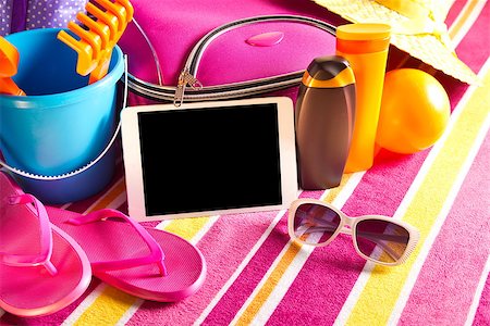 pink flip flops beach - Empty touch screen tablet with colorful beach towel, sunglasses, sun creams and beach accessories. Stock Photo - Budget Royalty-Free & Subscription, Code: 400-08753279