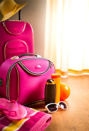 seaside home interior - Summer vacations packing with pink trolley case, sunglasses and sun creams. Stock Photo - Budget Royalty-Free & Subscription, Code: 400-08753327