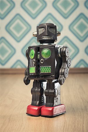 simsearch:400-07511289,k - Vintage funny tin toy robot on vintage wallpaper background. Fotografie stock - Microstock e Abbonamento, Codice: 400-08753377