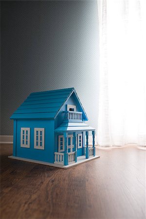 dollhouse room - Blue wooden model house next to a window with curtain on wooden floor. Foto de stock - Super Valor sin royalties y Suscripción, Código: 400-08753385