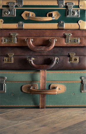 simsearch:649-08564128,k - Stack of colorful vintage suitcases, handles close up, travelling concept. Stockbilder - Microstock & Abonnement, Bildnummer: 400-08753416