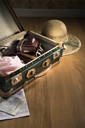 Vintage luggage with sunglasses, camera and straw hat on wooden floor. Stock Photo - Budget Royalty-Free & Subscription, Code: 400-08753506