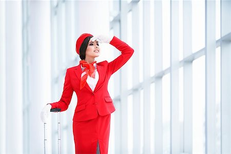 simsearch:400-04429524,k - Smiling stewardess at airport Stock Photo - Budget Royalty-Free & Subscription, Code: 400-08774500