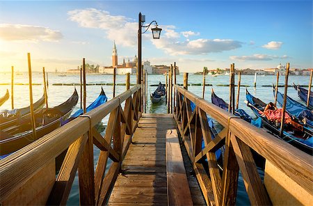 famous dock photograph sunrise - Condolas and wooden pier in Venice, Italy Stock Photo - Budget Royalty-Free & Subscription, Code: 400-08776298