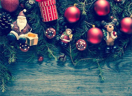 simsearch:400-08113383,k - Merry Christmas Frame with real wood green pine, colorful baubles, gift boxe and other seasonal stuff over an old wooden aged background Stock Photo - Budget Royalty-Free & Subscription, Code: 400-08778345