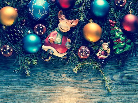 simsearch:400-08113383,k - Merry Christmas Frame with real wood green pine, colorful baubles, gift boxe and other seasonal stuff over an old wooden aged background Stock Photo - Budget Royalty-Free & Subscription, Code: 400-08778351
