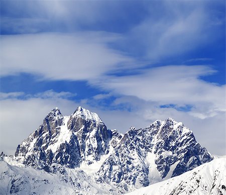 simsearch:400-08671175,k - Mounts Ushba and Chatyn and blue sky with clouds in winter day. Caucasus Mountains. Svaneti region of Georgia. Stock Photo - Budget Royalty-Free & Subscription, Code: 400-08778597