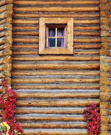 Russian rustic wooden house of logs with a window Stock Photo - Budget Royalty-Free & Subscription, Code: 400-08779324
