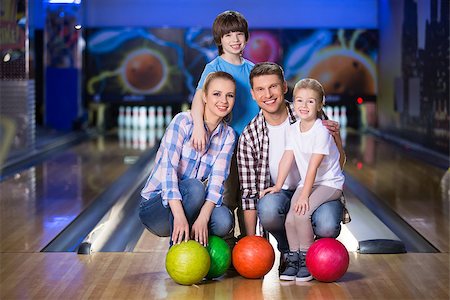 Smiling family with child in bowling Stock Photo - Budget Royalty-Free & Subscription, Code: 400-08770473