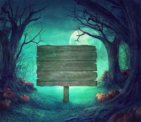 Halloween background. Spooky forest with dead trees and pumpkins.Halloween design with pumpkins. Wood sign Stock Photo - Budget Royalty-Free & Subscription, Code: 400-08771010