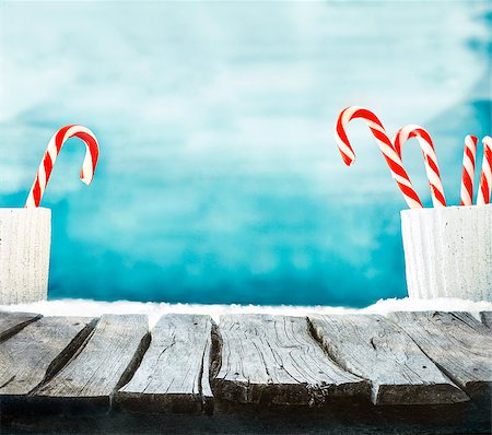 Christmas background. Wooden table with candy cane on snow. Empty winter display for your montage Stock Photo - Budget Royalty-Free & Subscription, Code: 400-08771079