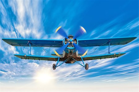 simsearch:400-09119906,k - picture of a biplane in the blue sky Photographie de stock - Aubaine LD & Abonnement, Code: 400-08771191