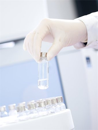 Technician loading sample vials in autosampler rack. Stock Photo - Budget Royalty-Free & Subscription, Code: 400-08771814