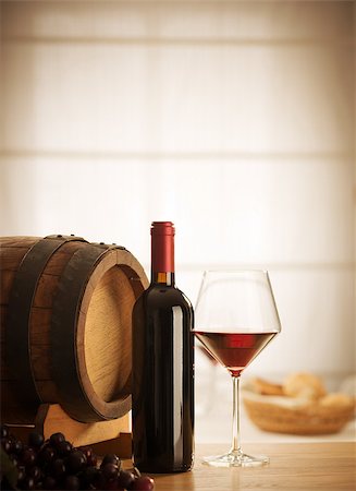 simsearch:400-09222970,k - Red wine glass and bottle still life at restaurant. Stock Photo - Budget Royalty-Free & Subscription, Code: 400-08771828