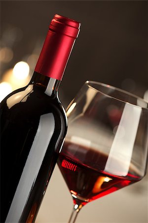 simsearch:400-09222970,k - Red wine glass and bottle close up with restaurant on background. Stock Photo - Budget Royalty-Free & Subscription, Code: 400-08771831