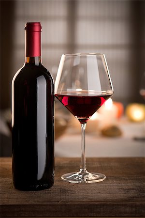 simsearch:400-09222970,k - Red wine glass and bottle close up with restaurant on background. Stock Photo - Budget Royalty-Free & Subscription, Code: 400-08771832