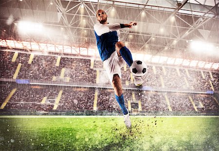 simsearch:400-09032434,k - Football player play in a stadium with audience Stockbilder - Microstock & Abonnement, Bildnummer: 400-08772555