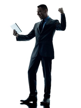 simsearch:400-08317008,k - one caucasian business man standing using digital tablet  happy silhouette isolated on white background Stockbilder - Microstock & Abonnement, Bildnummer: 400-08773267
