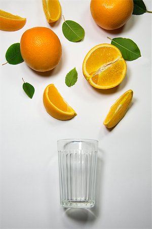 simsearch:400-05911768,k - Fresh orange juice flowing from apple piece into the glass Photographie de stock - Aubaine LD & Abonnement, Code: 400-08773497