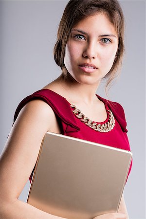 simsearch:400-08831347,k - intense look of a beautiful business woman holding a digital tablet pro and she has extraordinary beautiful eyes Stock Photo - Budget Royalty-Free & Subscription, Code: 400-08784506