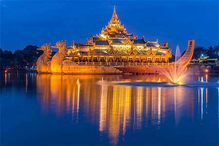 Golden Karaweik palace on Kandawgyi lake looks like an ancient royal barge. Twilight time. Yangon, Myanmar Stock Photo - Budget Royalty-Free & Subscription, Code: 400-08784594