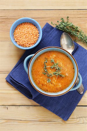 simsearch:400-08786286,k - homemade tasty red lentil soup with thyme Fotografie stock - Microstock e Abbonamento, Codice: 400-08786285