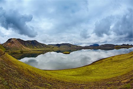 Lake coast with mountain reflection at the cloudy day, Iceland Stock Photo - Budget Royalty-Free & Subscription, Code: 400-08787097