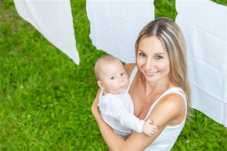 simsearch:400-08787277,k - Beautiful mother and her baby boy playing together outdoors Stock Photo - Budget Royalty-Free & Subscription, Code: 400-08787276