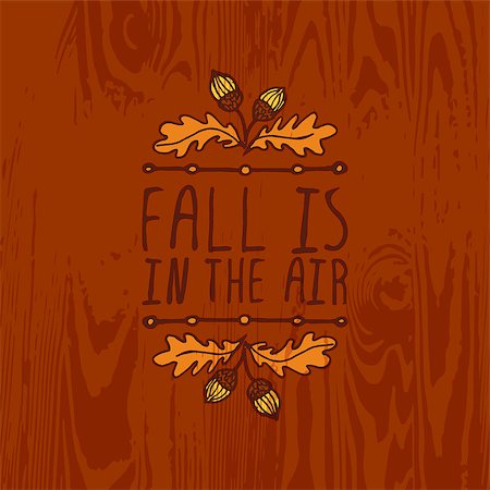simsearch:400-08793659,k - Hand-sketched typographic element with acorns and text on wooden background. Fall is in the air Stock Photo - Budget Royalty-Free & Subscription, Code: 400-08787464