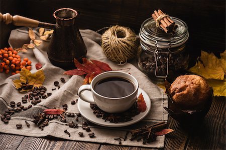 Autumn Leaves with Cup of Coffee and Muffin, Ingredients, Spices and Some Kitchenware on tablecloth. Stock Photo - Budget Royalty-Free & Subscription, Code: 400-08788048